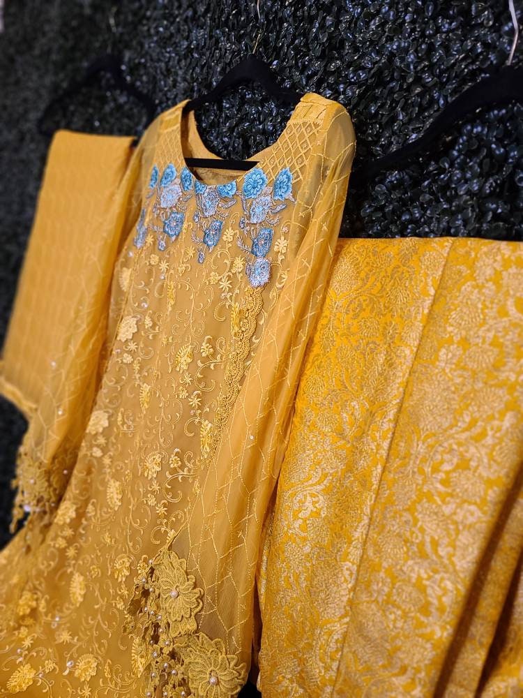 Beautiful yellow chikankari on pure chiffon.  Pakistani designer wear.