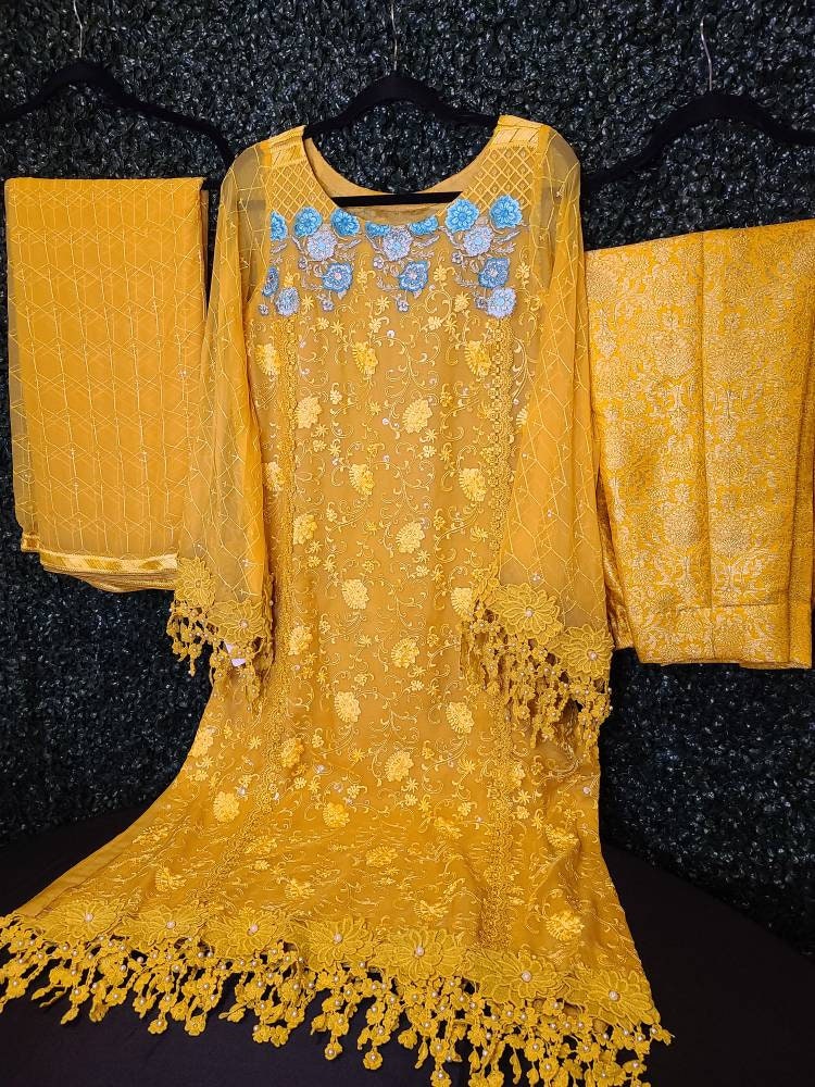 Beautiful yellow chikankari on pure chiffon.  Pakistani designer wear.