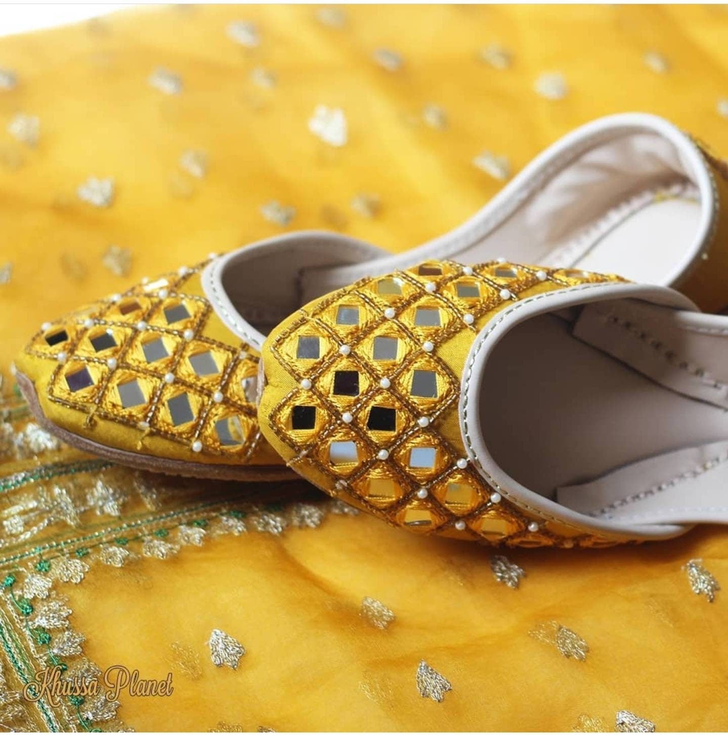 Featuring a stunning yellow mirror Embroidered khussa with detailed diamond placement of cut dana.