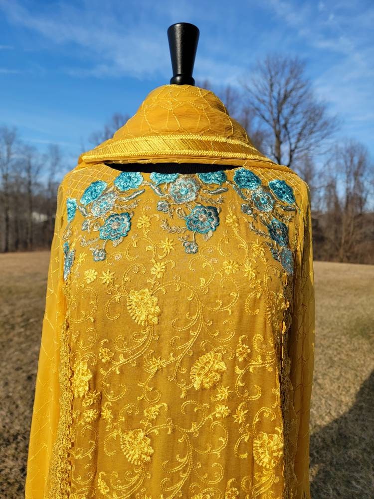 Beautiful yellow chikankari on pure chiffon.  Pakistani designer wear.