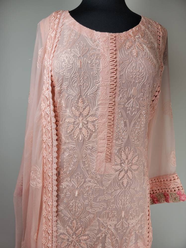 Gorgeous light pink chikankari formal wear.