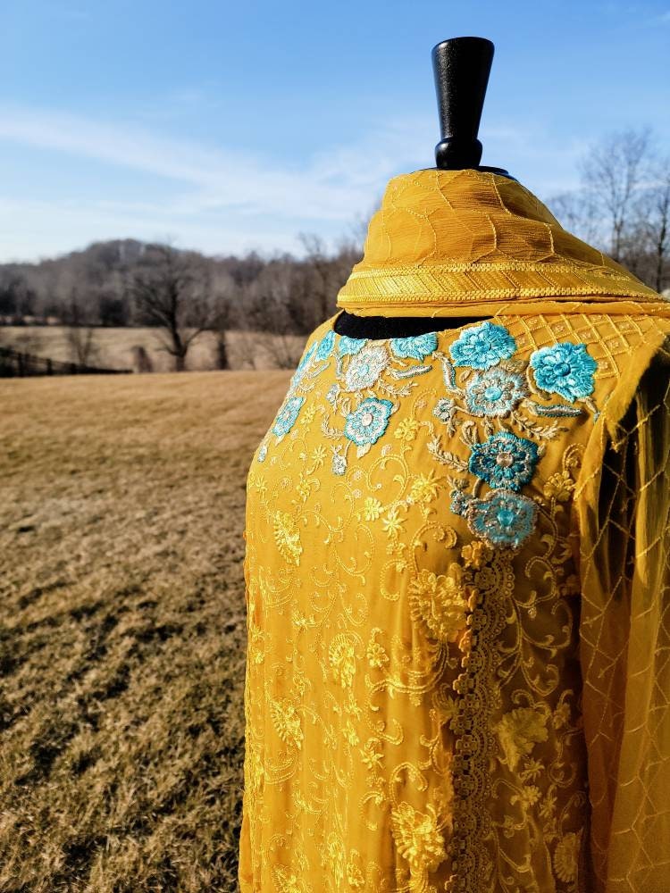 Beautiful yellow chikankari on pure chiffon.  Pakistani designer wear.