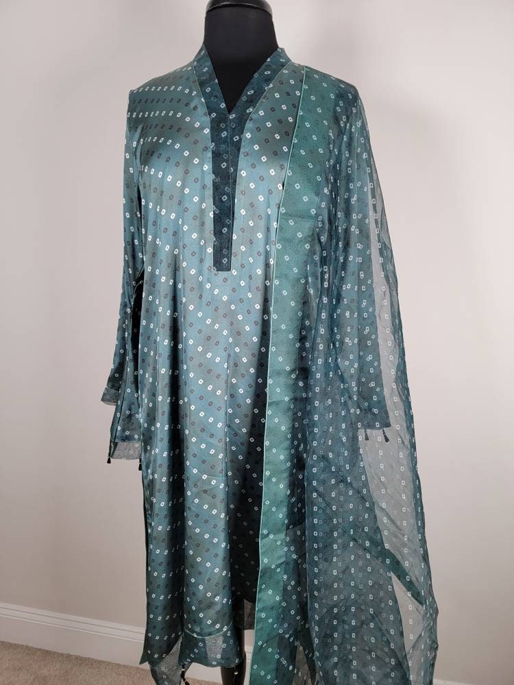 Chunri design silk shirt with plain silk pant and organza Dupatta.