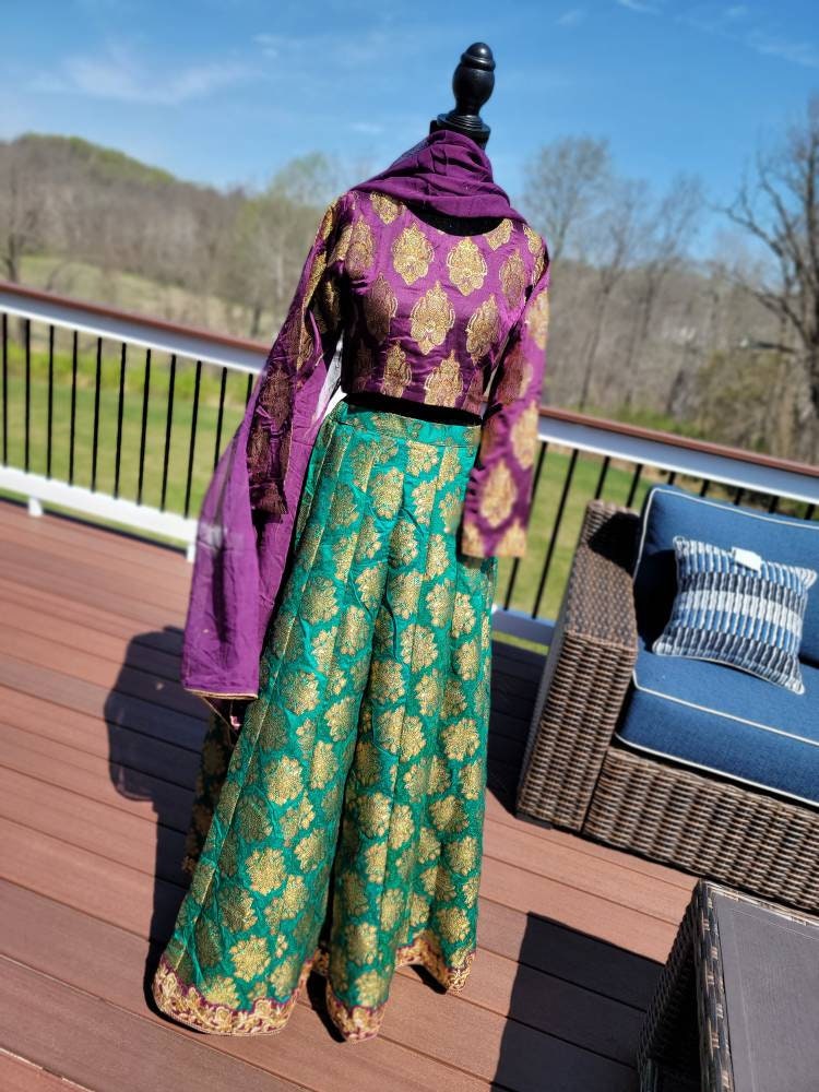 Purple/green pure atlas jamawar gharara with choli and duppata.