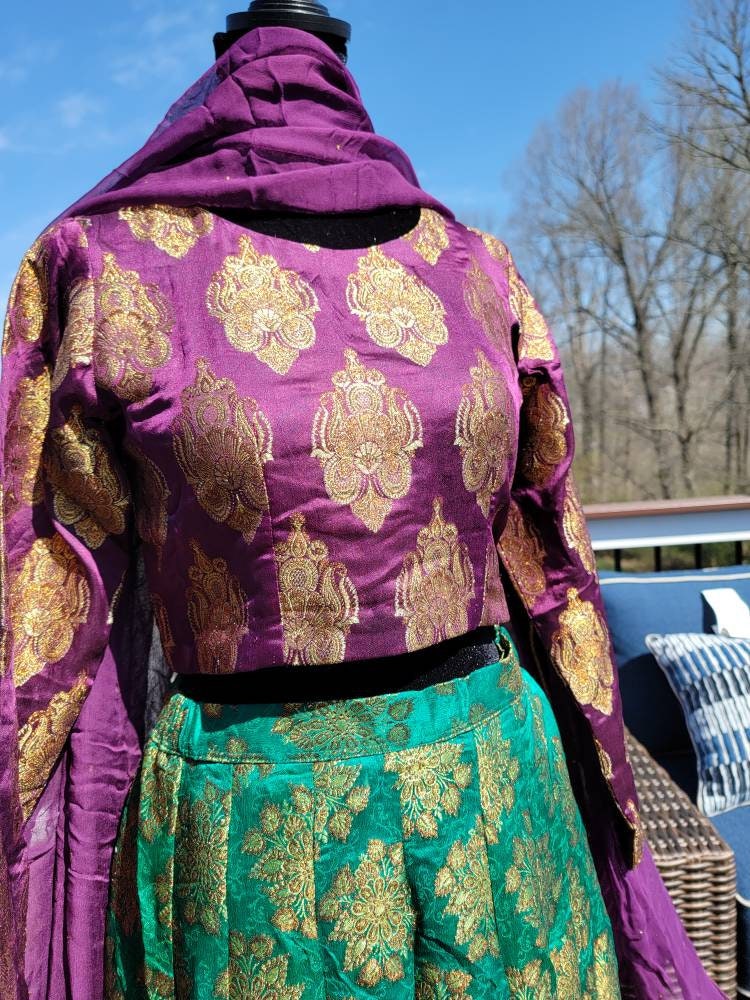 Purple/green pure atlas jamawar gharara with choli and duppata.