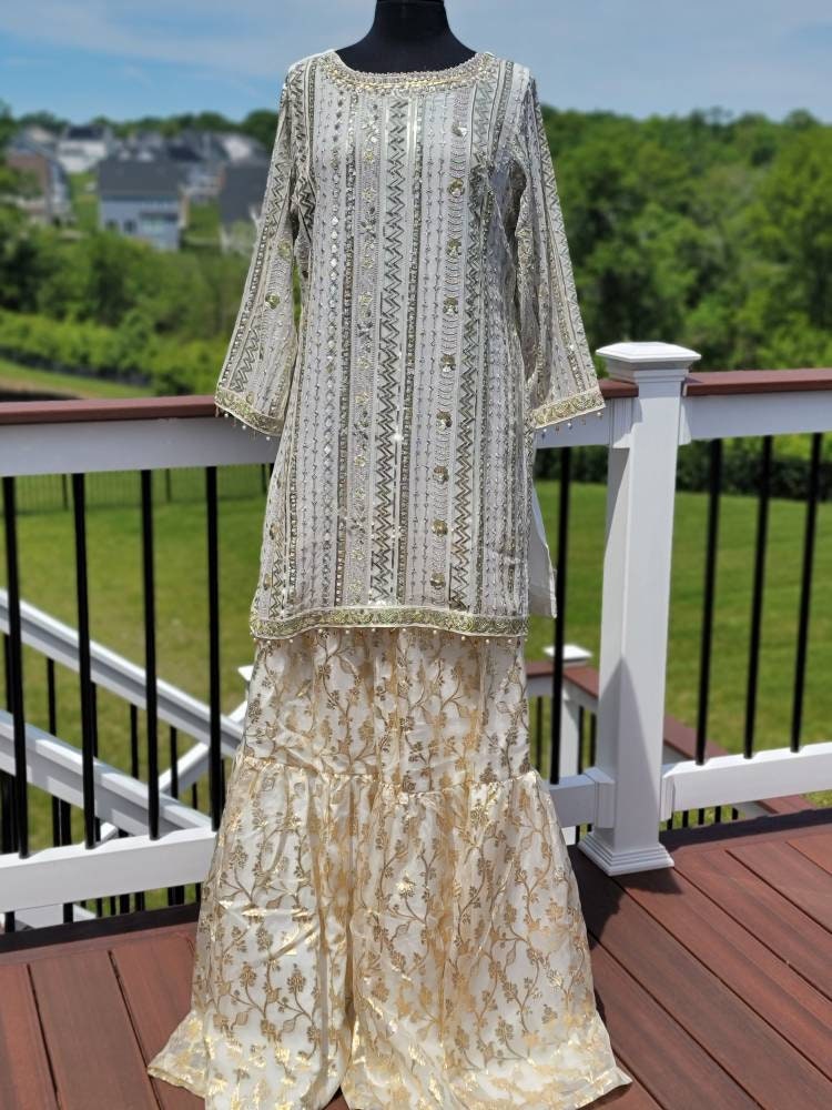 White chikankari with sequins shirt with duppata and lehenga.