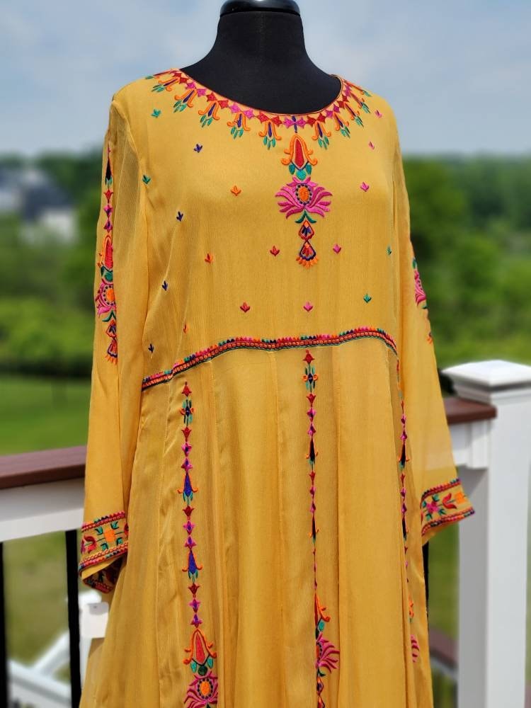 Yellow Embroidered multicolored frock. Size large.