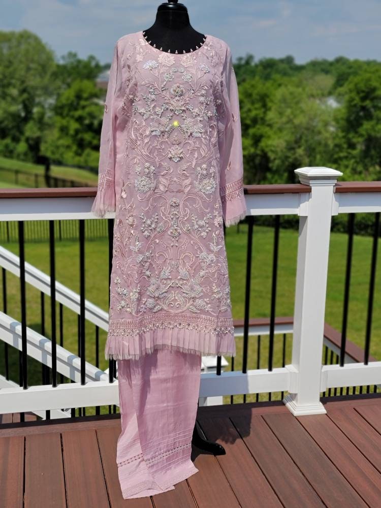 Summer is here. This light powder pink outfit is perfect for summer wardrobe. Heavy handwork on all over shirt.