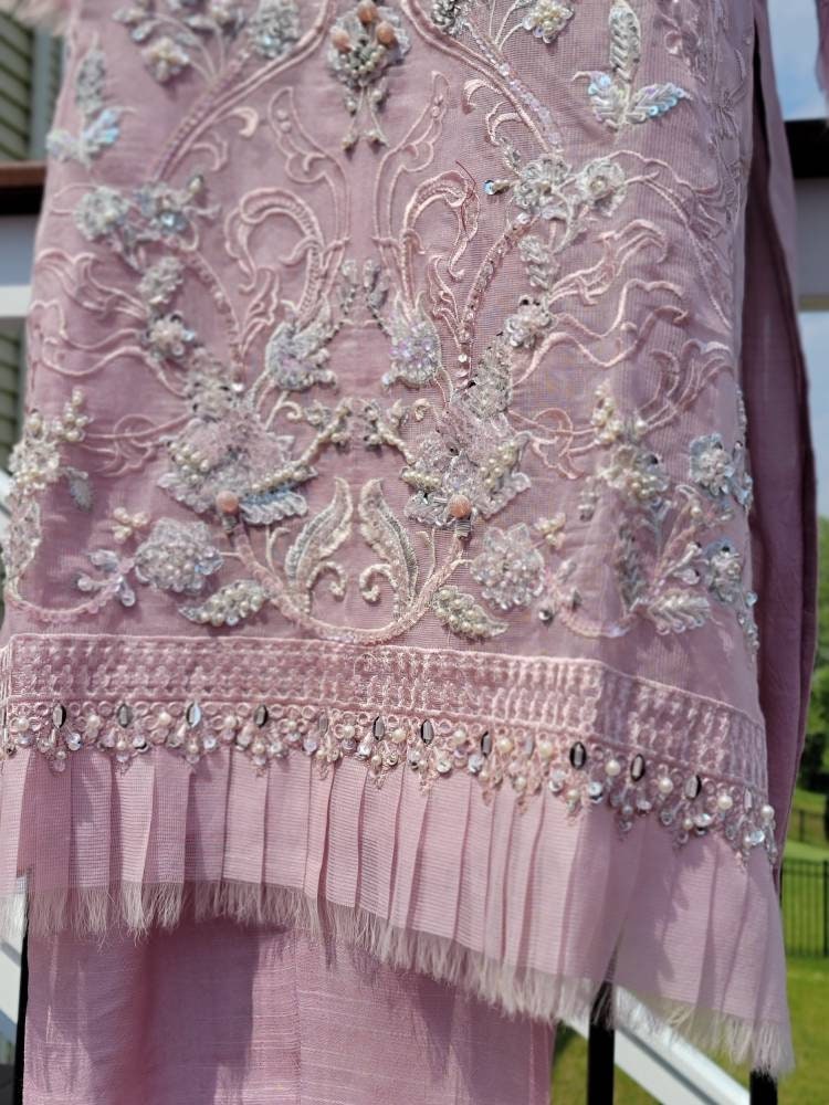 Summer is here. This light powder pink outfit is perfect for summer wardrobe. Heavy handwork on all over shirt.