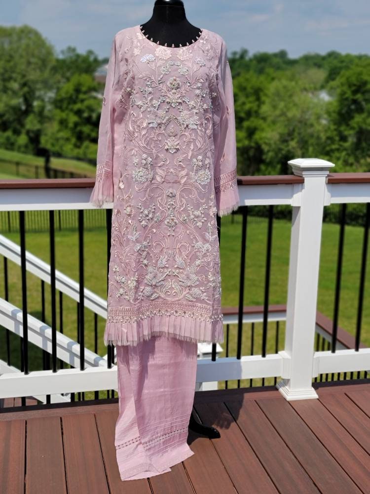 Summer is here. This light powder pink outfit is perfect for summer wardrobe. Heavy handwork on all over shirt.