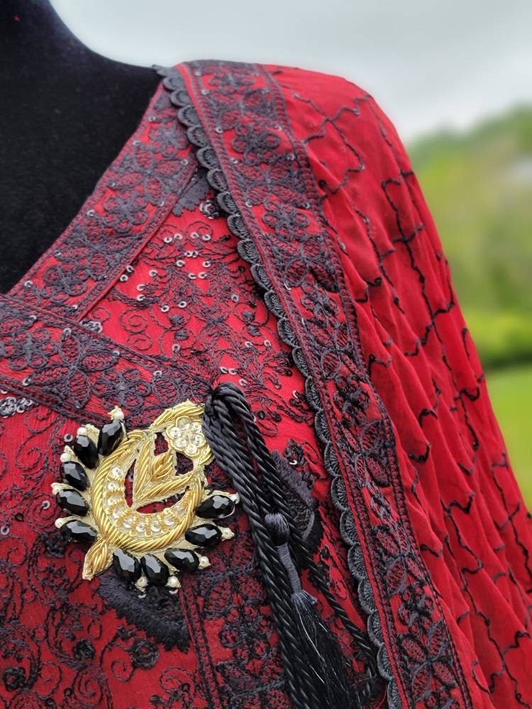 Deep red with black chikankari shirt. Paired with heavy Embroidered dupatta and silk trouser. Pakistani ready to wear.