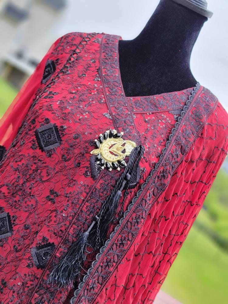 Deep red with black chikankari shirt. Paired with heavy Embroidered dupatta and silk trouser. Pakistani ready to wear.