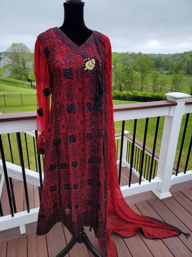 Deep red with black chikankari shirt. Paired with heavy Embroidered dupatta and silk trouser. Pakistani ready to wear.