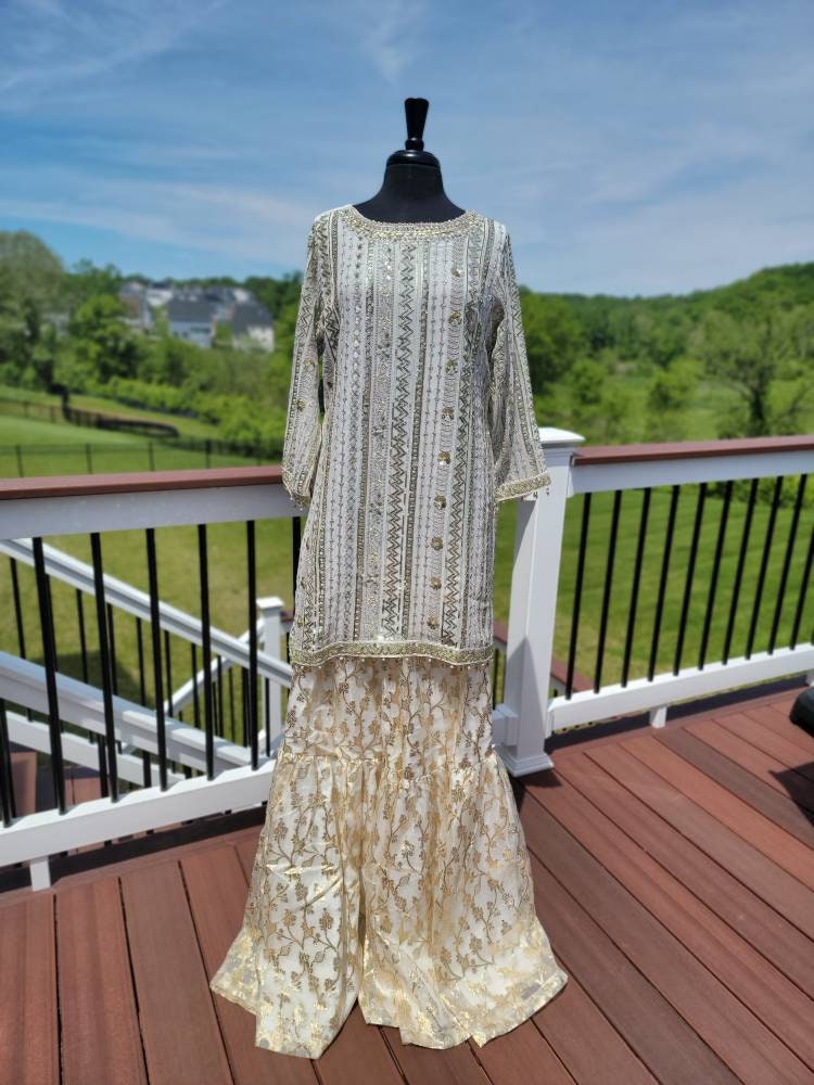 White chikankari with sequins shirt with duppata and lehenga.