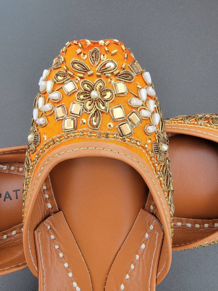 Orange khussa with mirror work.  Pakistani ready to wear.