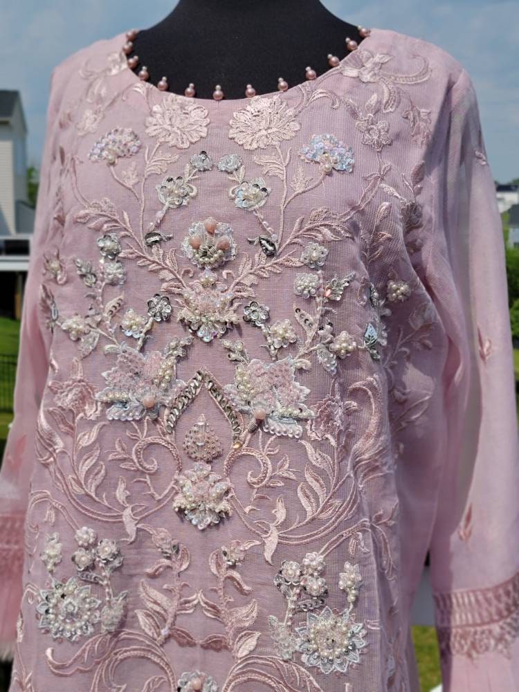 Summer is here. This light powder pink outfit is perfect for summer wardrobe. Heavy handwork on all over shirt.