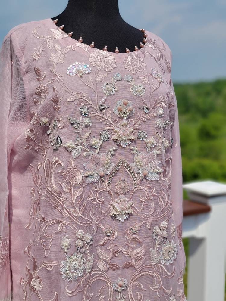 Summer is here. This light powder pink outfit is perfect for summer wardrobe. Heavy handwork on all over shirt.