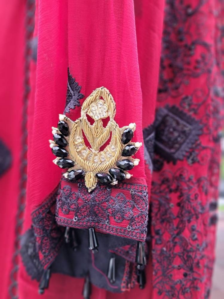 Deep red with black chikankari shirt. Paired with heavy Embroidered dupatta and silk trouser. Pakistani ready to wear.