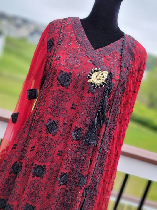 Deep red with black chikankari shirt. Paired with heavy Embroidered dupatta and silk trouser. Pakistani ready to wear.