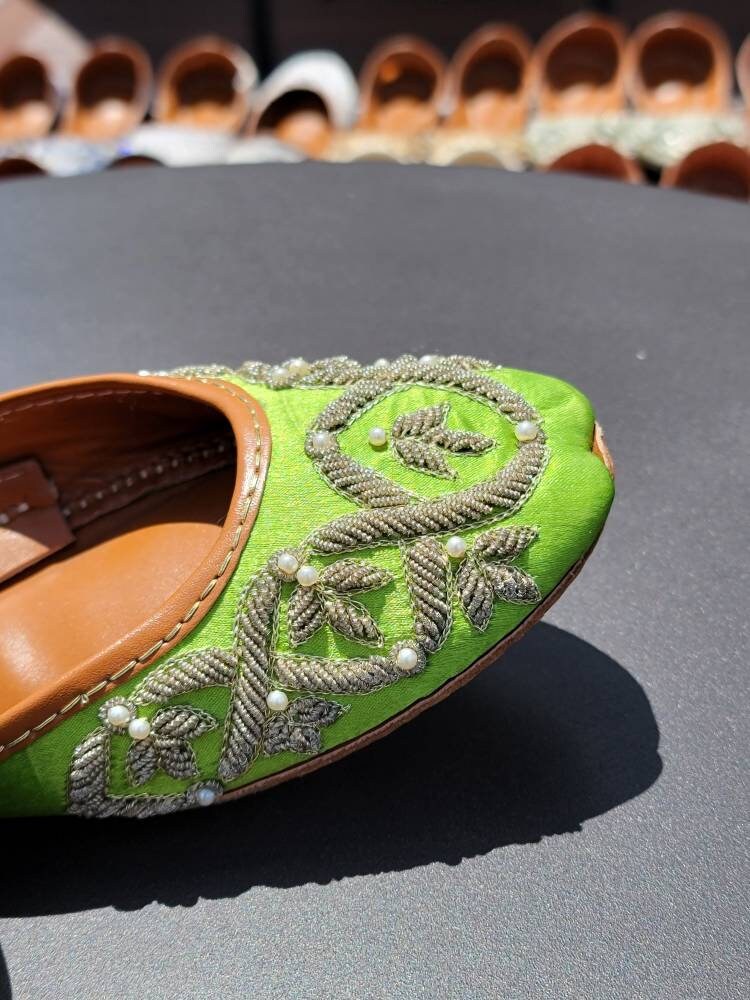 Gorgeous green khussa with kora dabka work.