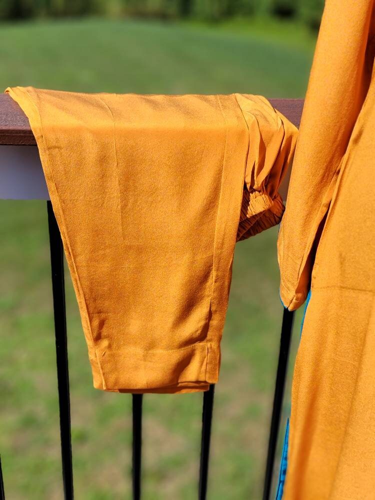 Orange Crinkle Chiffon shirt with pant and block print silk dupatta. Pakistani ready to wear.