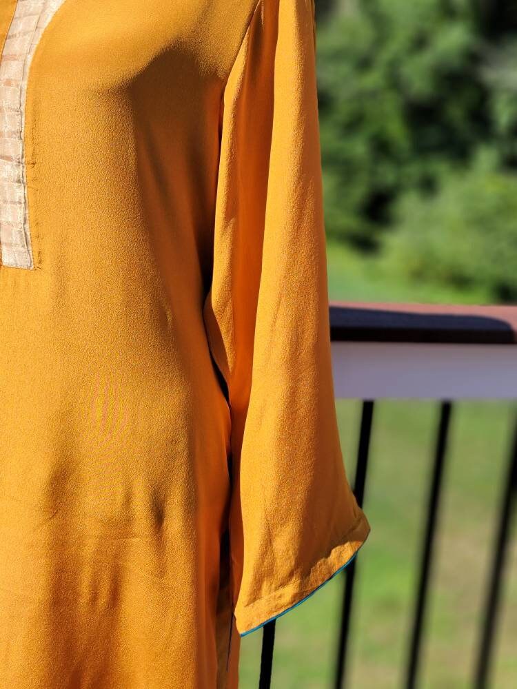 Orange Crinkle Chiffon shirt with pant and block print silk dupatta. Pakistani ready to wear.