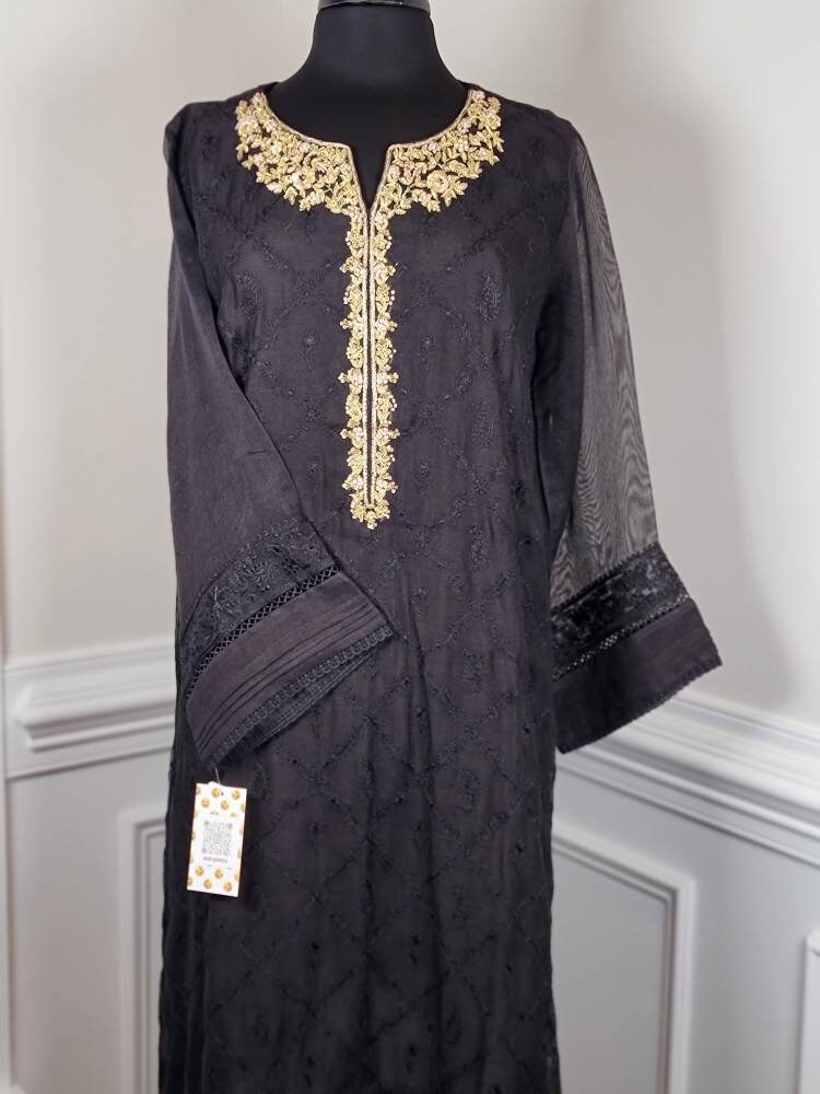 Black cotton net shirt with handwork on gala . Paired with raw silk pant.  Agha noor. Ready to wear.