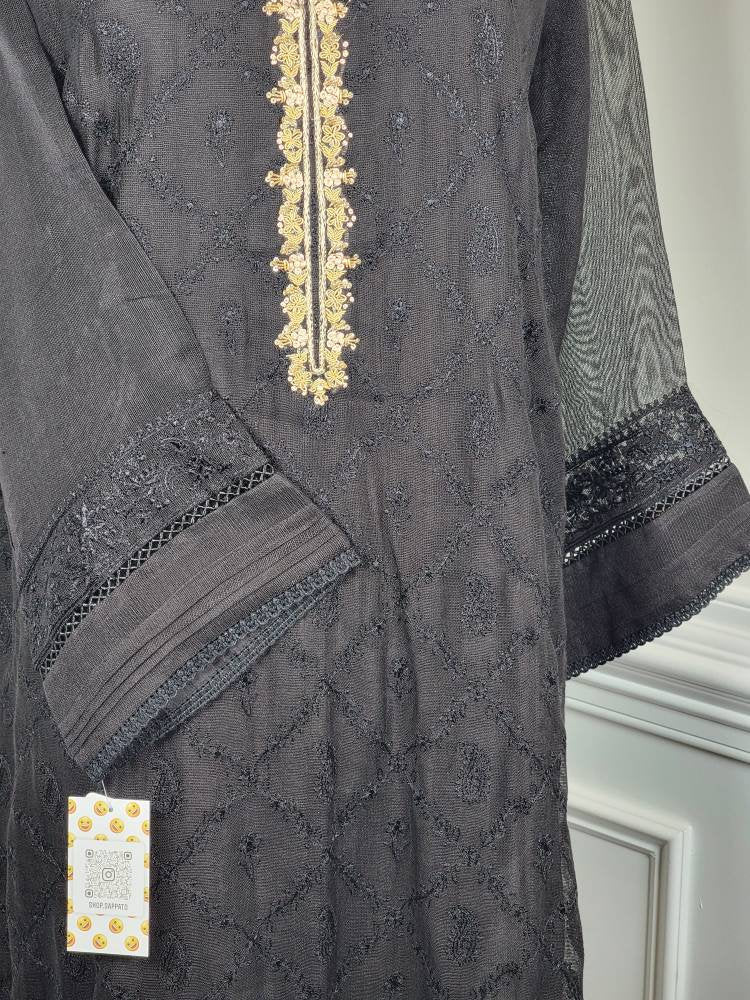 Black cotton net shirt with handwork on gala . Paired with raw silk pant.  Agha noor. Ready to wear.