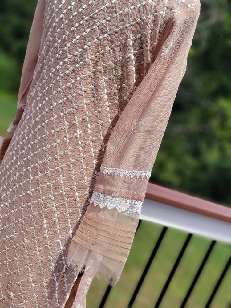 Sand beige khadi net with duppata and silk trouser.  Pakistani ready to wear.