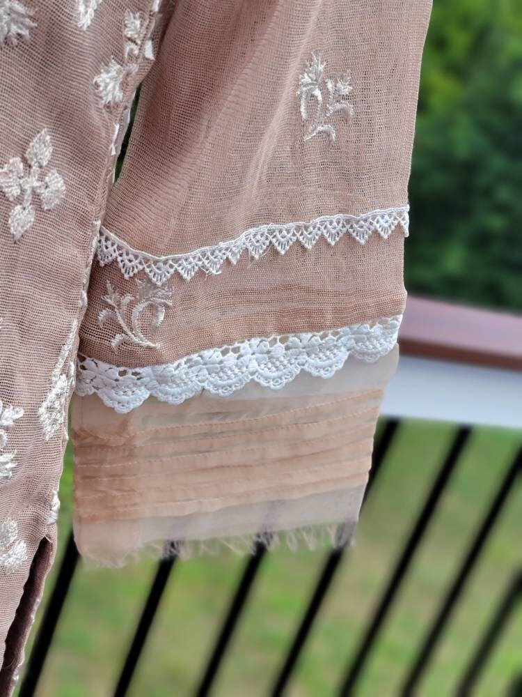 Sand beige khadi net with duppata and silk trouser.  Pakistani ready to wear.