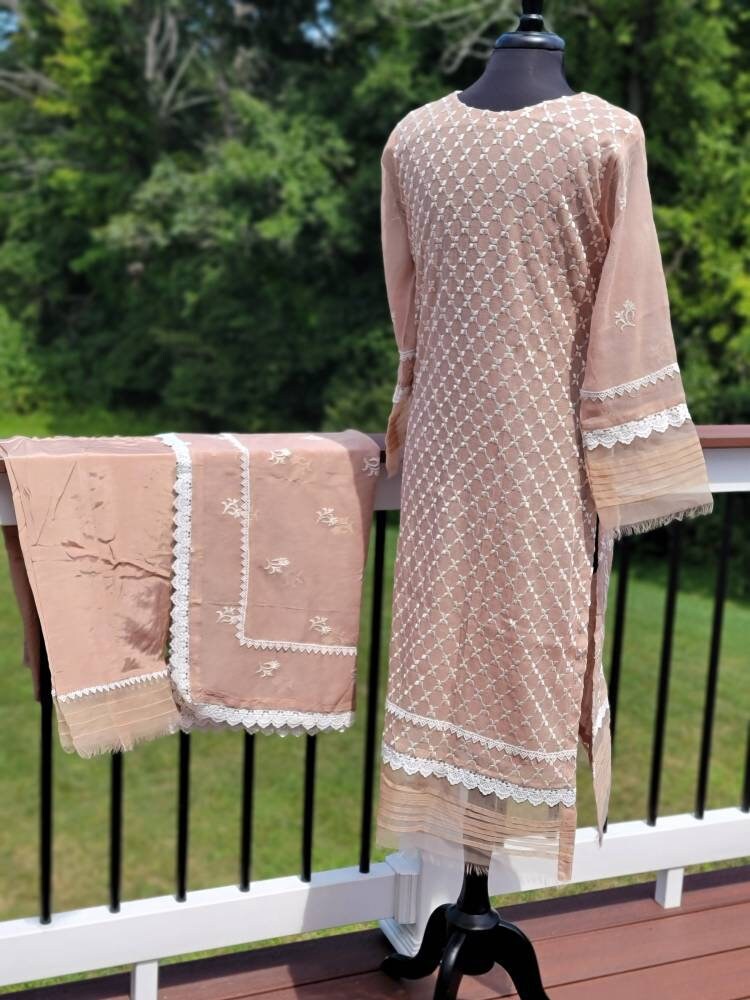 Sand beige khadi net with duppata and silk trouser.  Pakistani ready to wear.