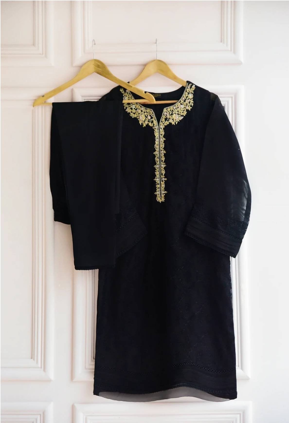 Black cotton net shirt with handwork on gala . Paired with raw silk pant.  Agha noor. Ready to wear.