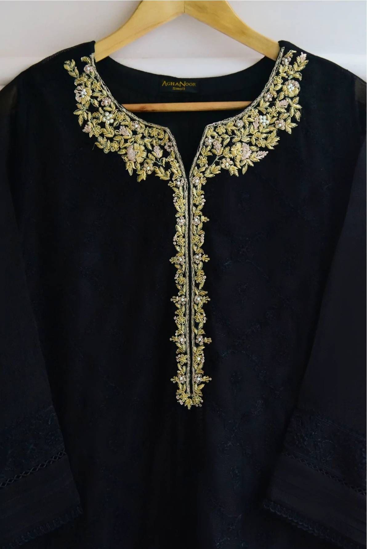 Black cotton net shirt with handwork on gala . Paired with raw silk pant.  Agha noor. Ready to wear.