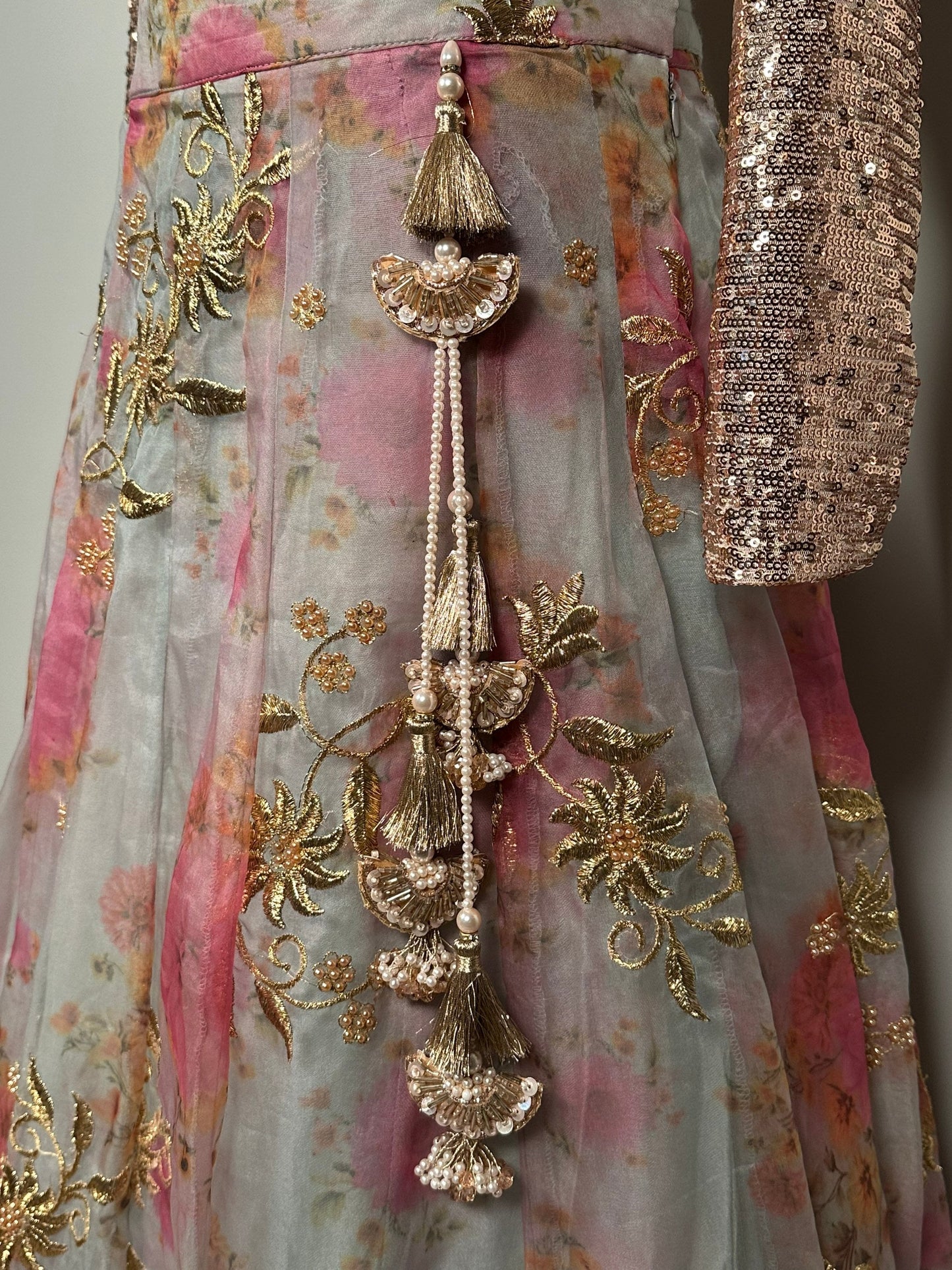 Gorgeous organza lehenga with all over pearl work. Paired with sequins choli and organza dupatta. Pakistani designer wear.