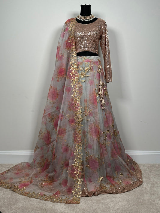 Gorgeous organza lehenga with all over pearl work. Paired with sequins choli and organza dupatta. Pakistani designer wear.