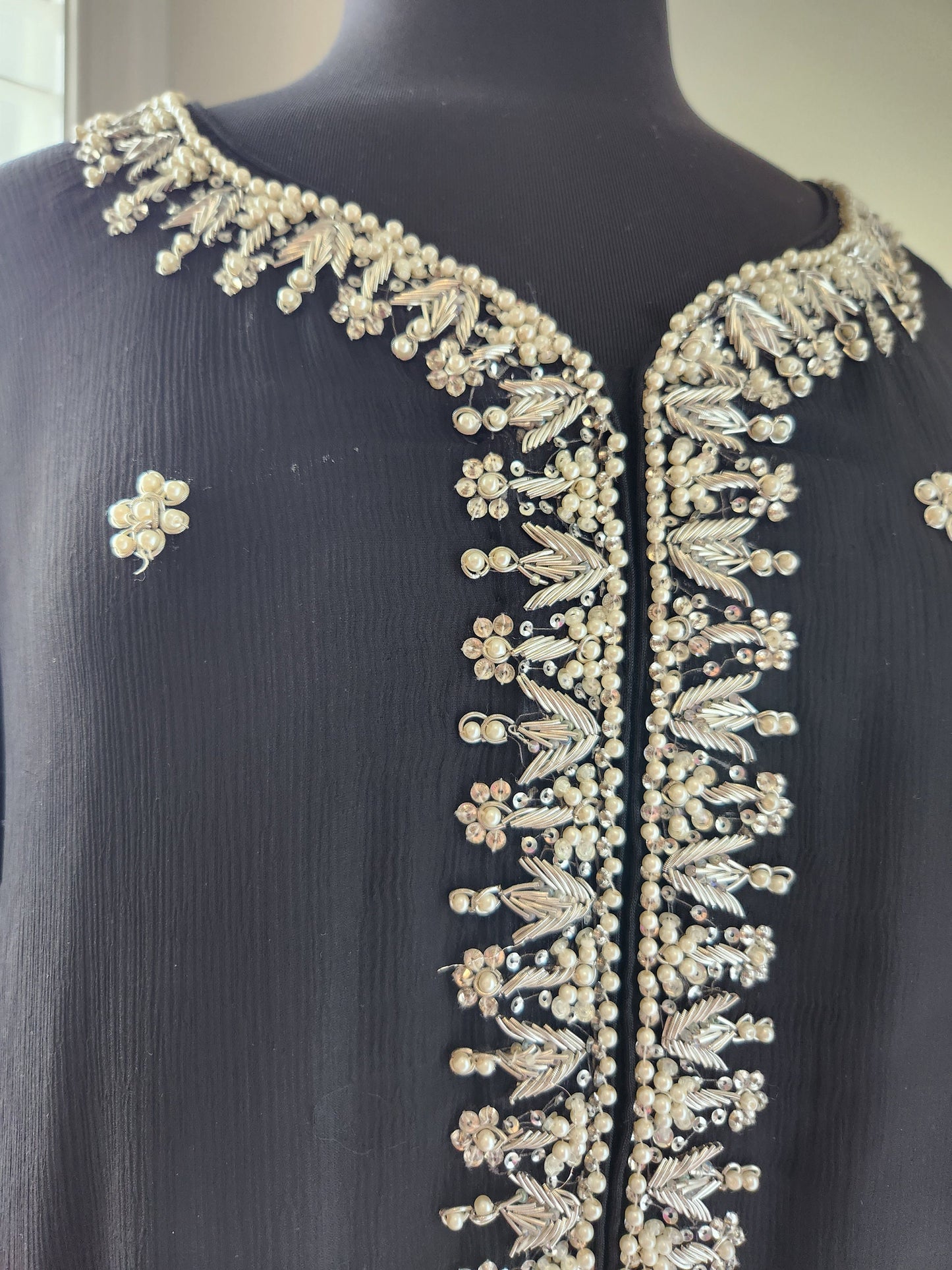 Black chiffon with silver kora dabka pearl handwork. Size large .