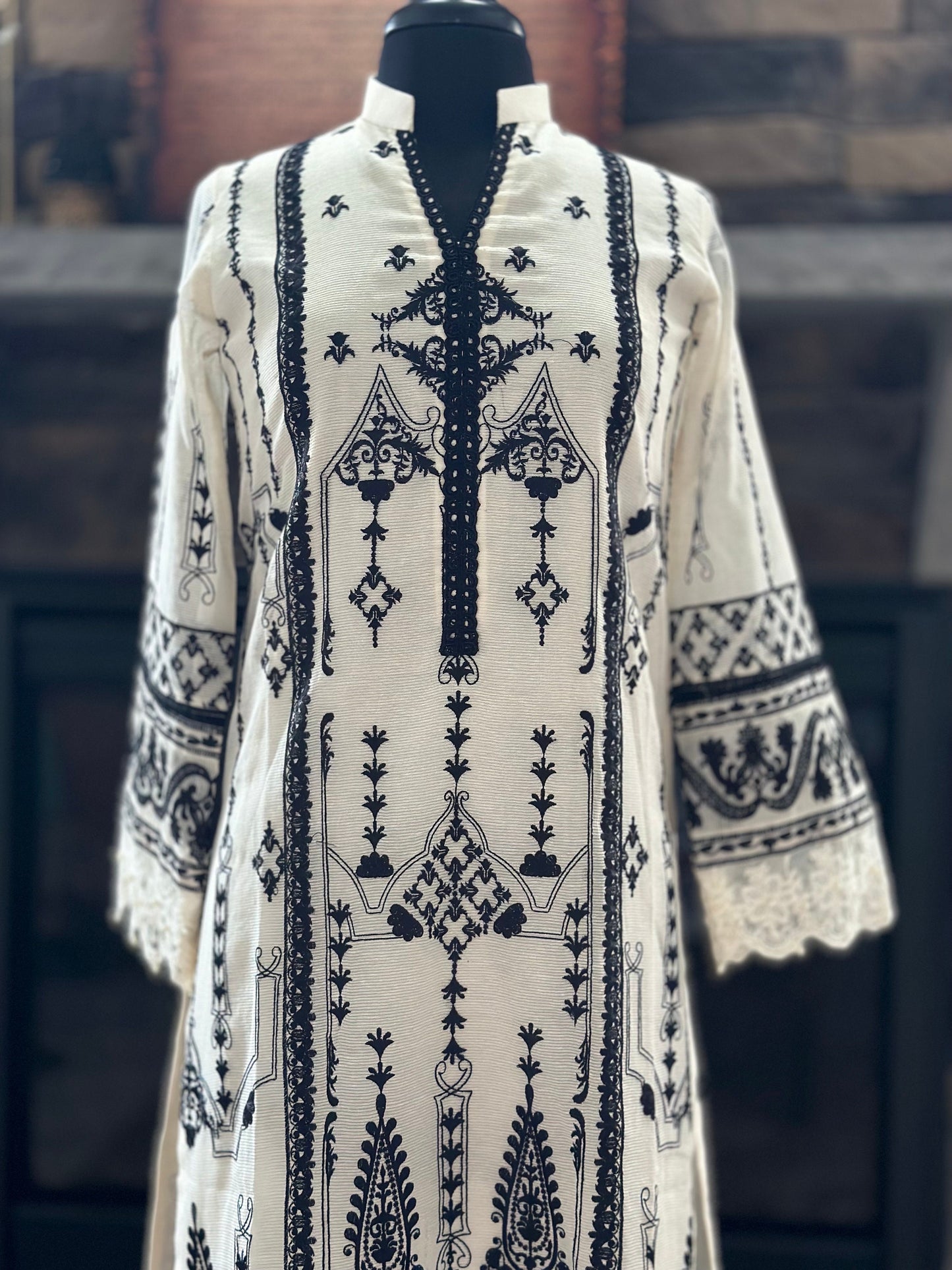 Our favorite combo black and white. This monochrome design is perfect for any day or night event. All over thread embroidery on shirt. 3 pcs