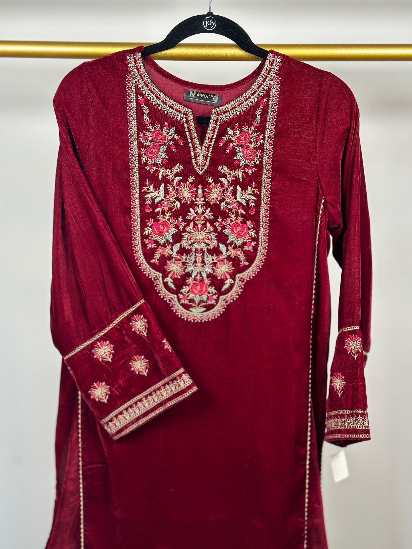 Maroon velvet kurti only with embroidery.