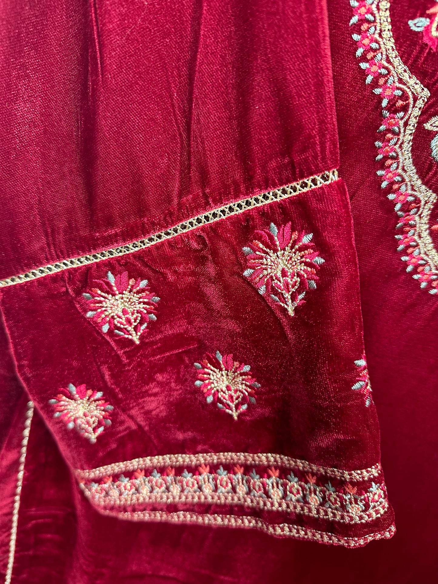 Maroon velvet kurti only with embroidery.