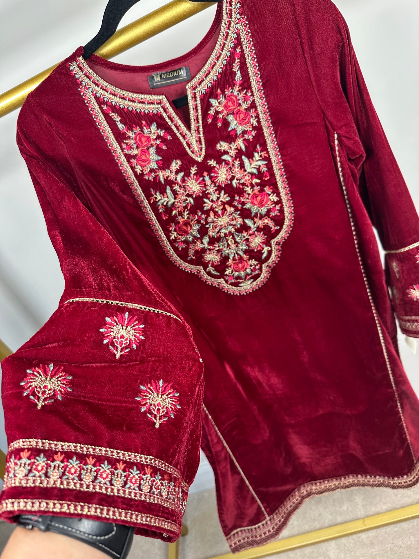 Maroon velvet kurti only with embroidery.