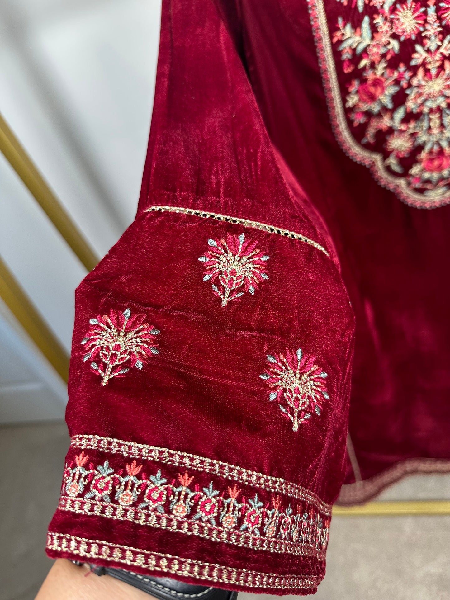 Maroon velvet kurti only with embroidery.