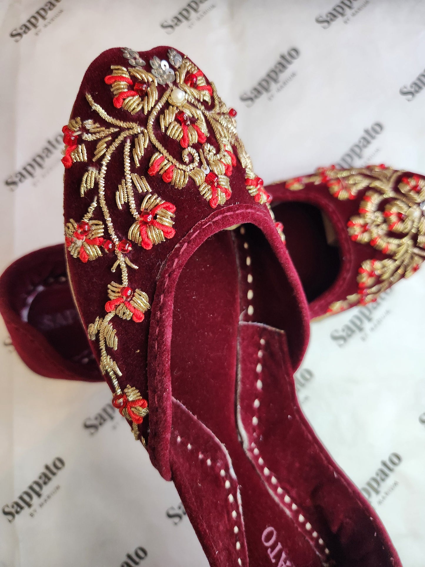 Maroon and gold velvet khussa.