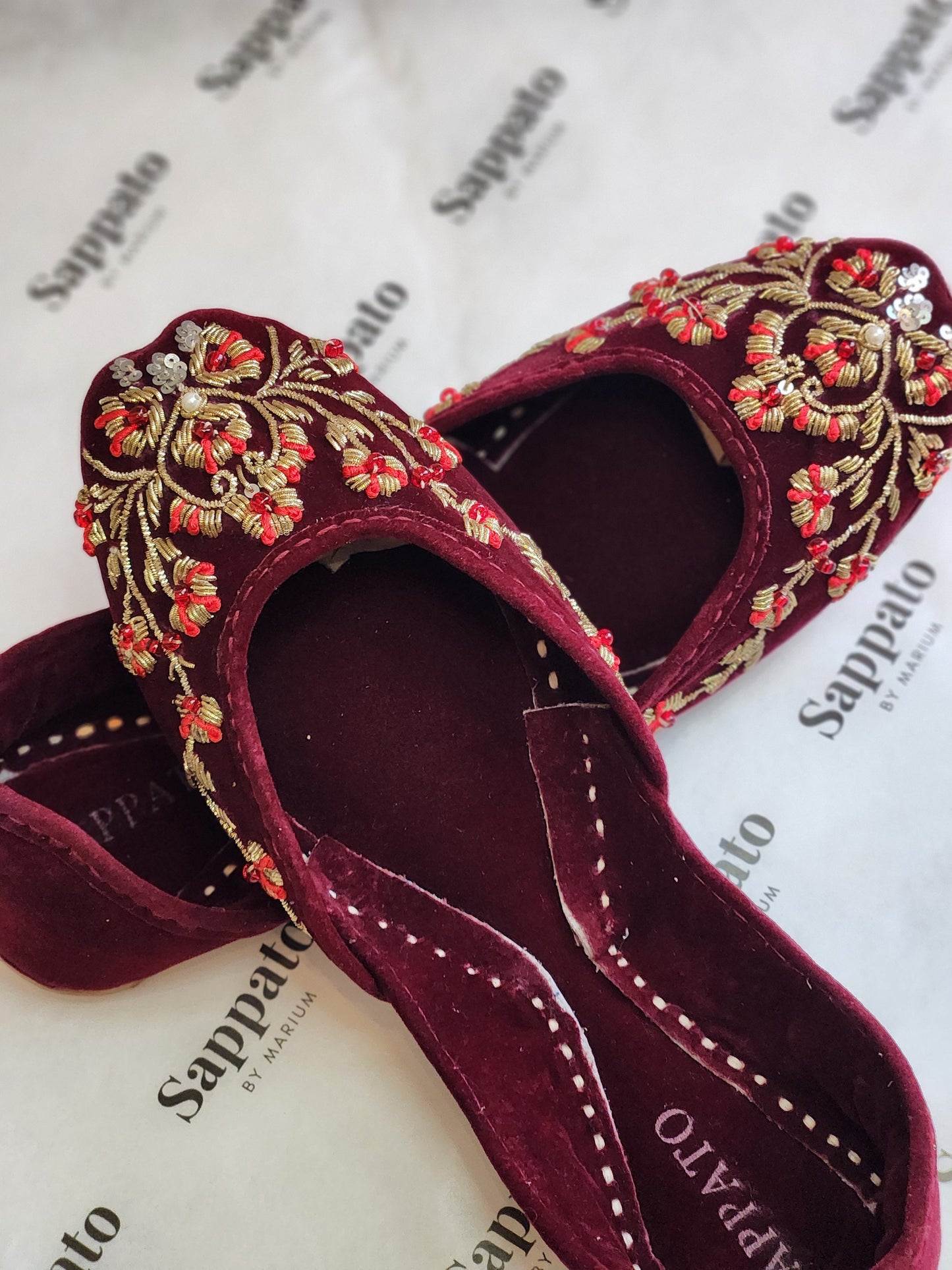 Maroon and gold velvet khussa.