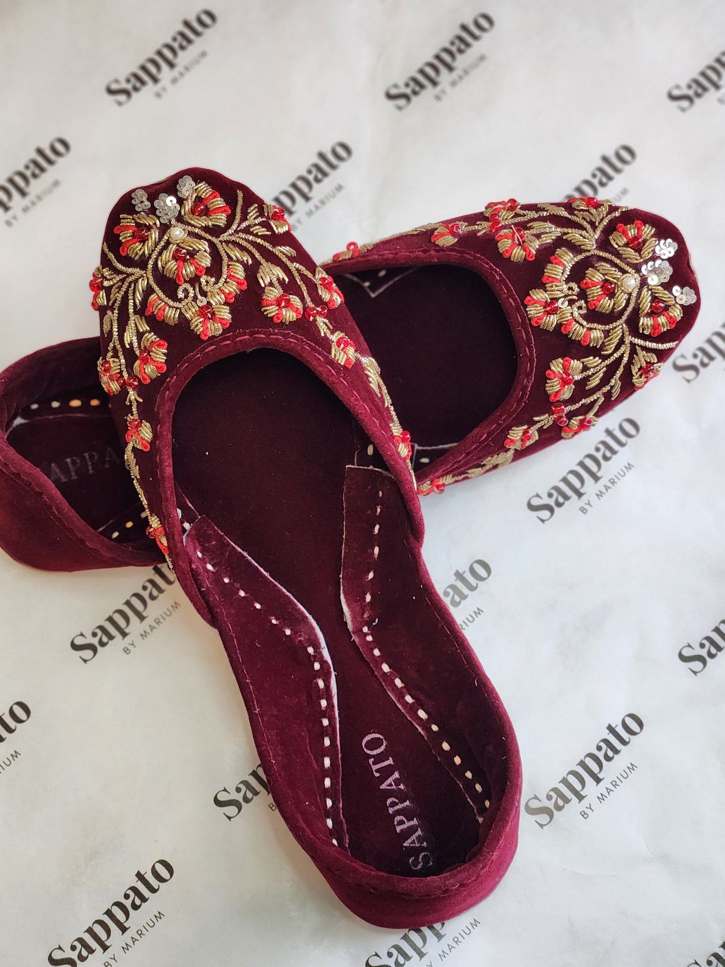 Maroon and gold velvet khussa.