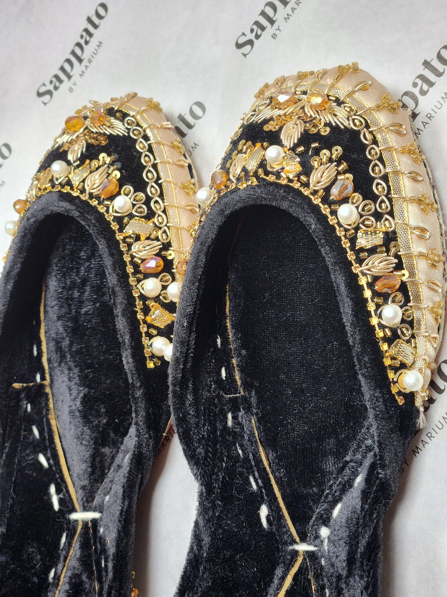 Black and gold velvet khussa .