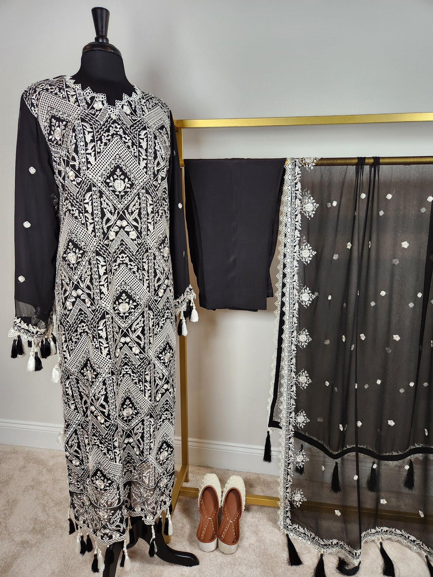 Black and white ! Black base with all over white resham chikankari on shirt and duppata.  Plain trouser included.