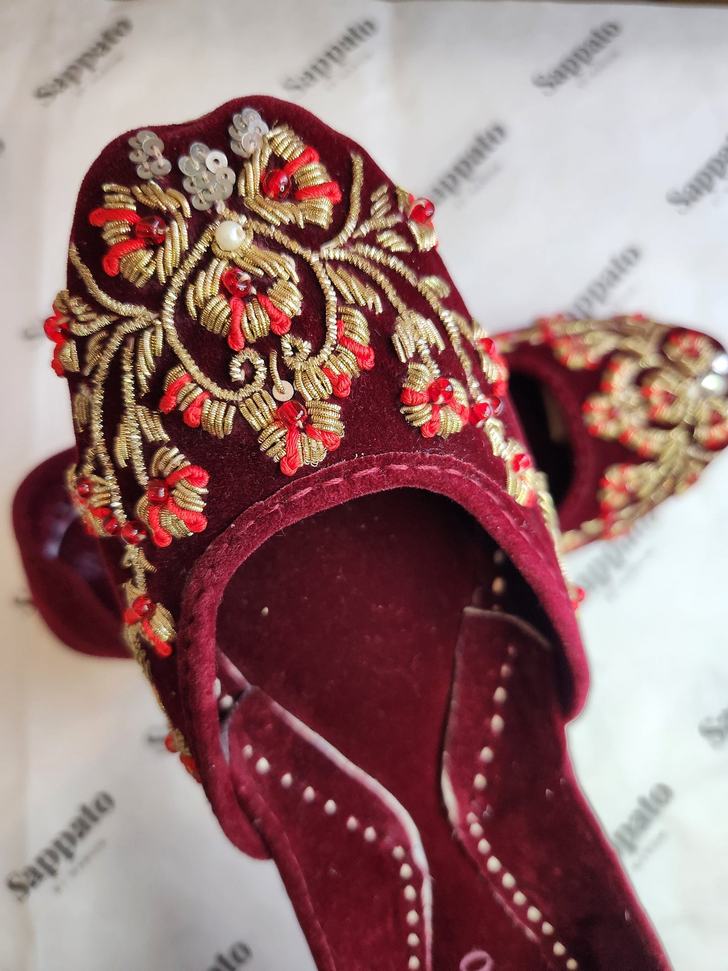 Maroon and gold velvet khussa.