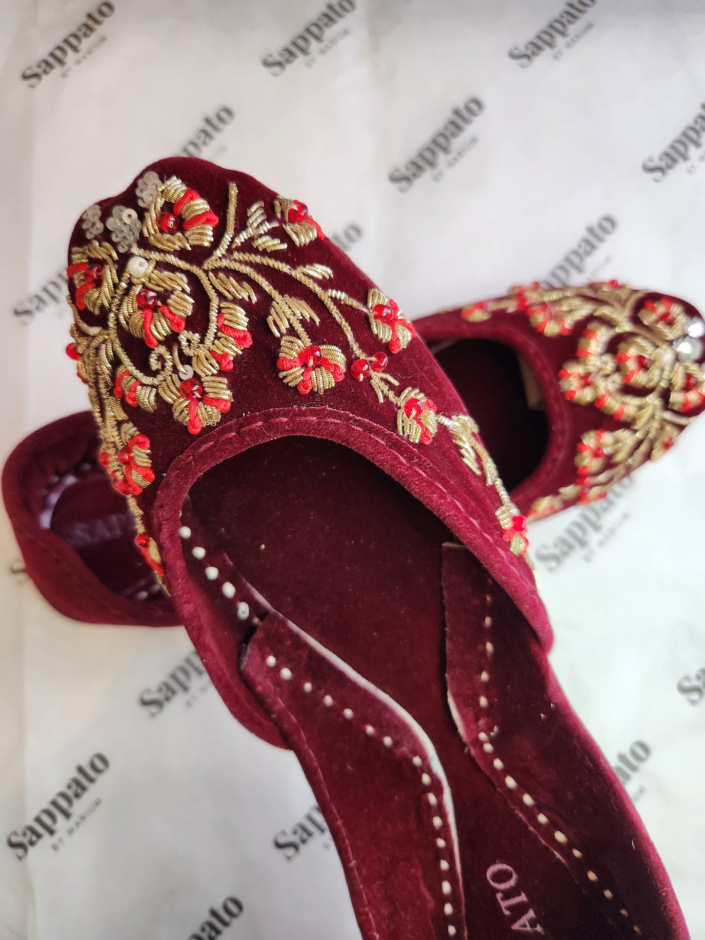 Maroon and gold velvet khussa.