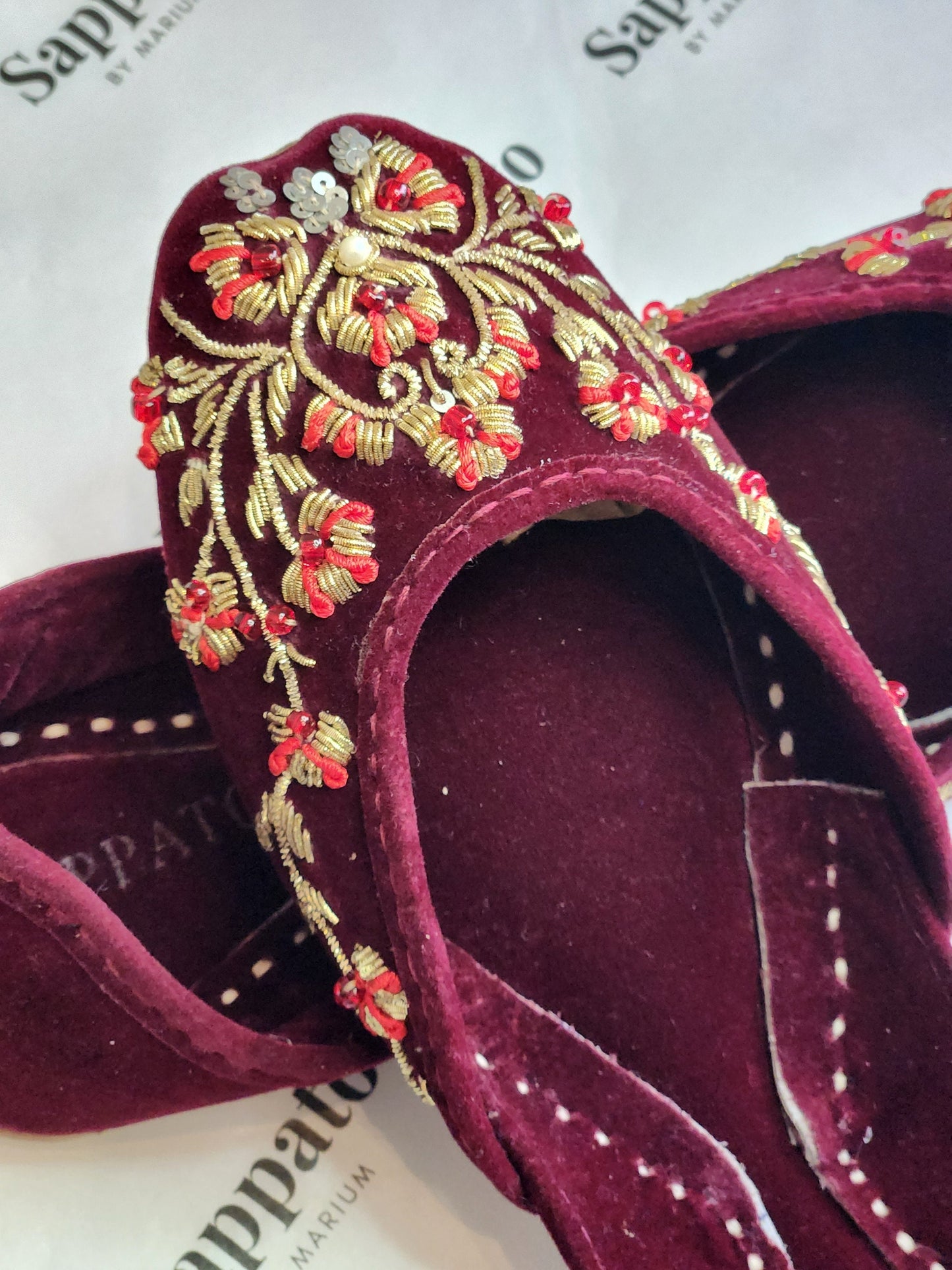 Maroon and gold velvet khussa.