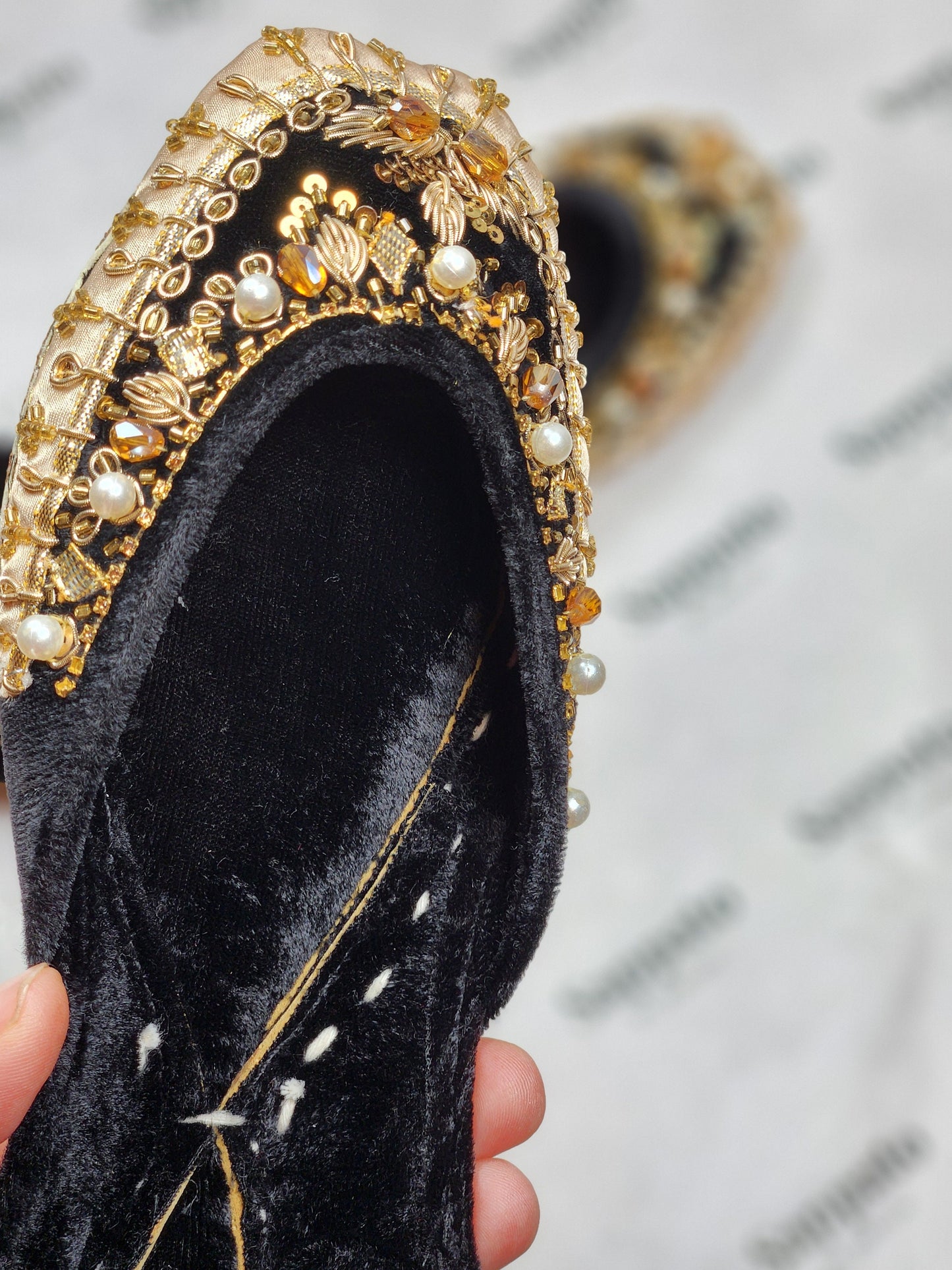 Black and gold velvet khussa .